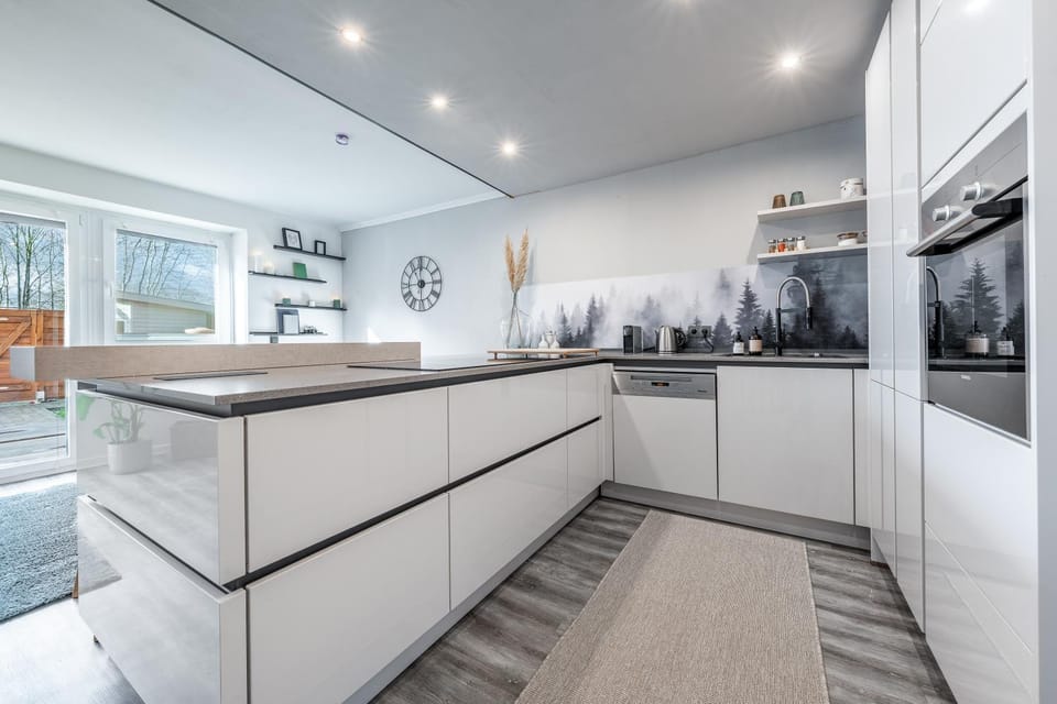 Kitchen or kitchenette, dishwasher, oven, stove