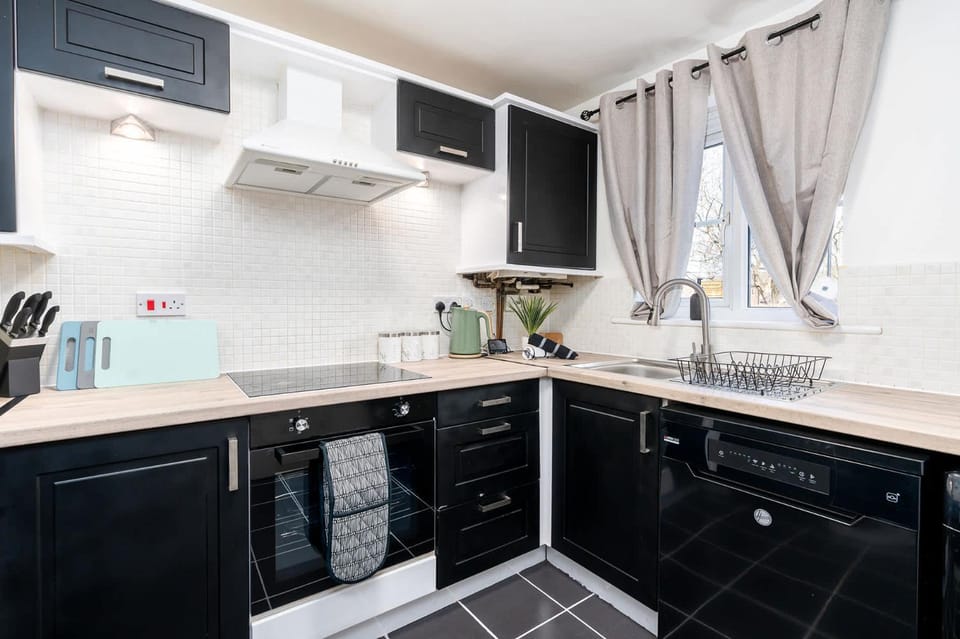Kitchen or kitchenette, dishwasher, oven, stove, toaster
