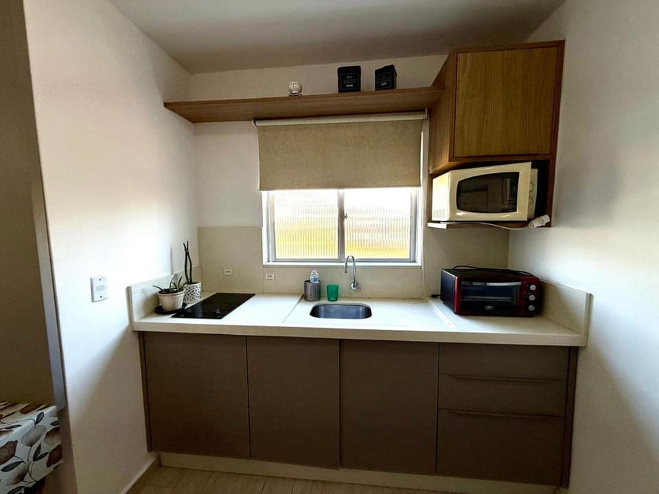 Kitchen or kitchenette, stove, toaster