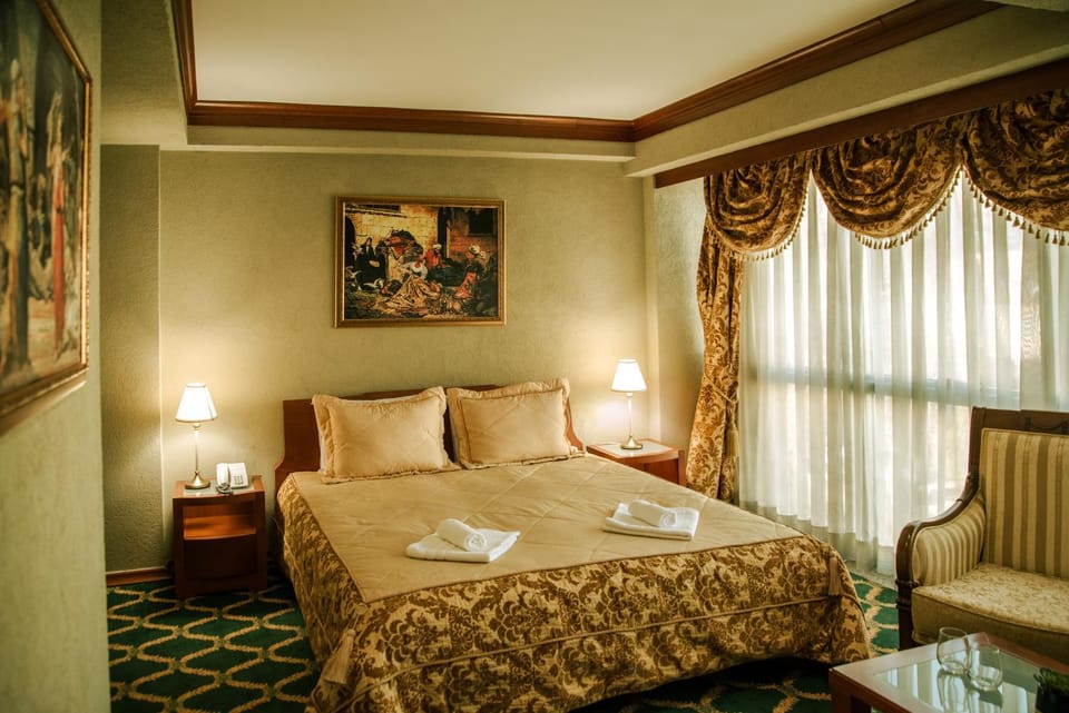 Bed, Living room, Seating area, Bedroom, towels
