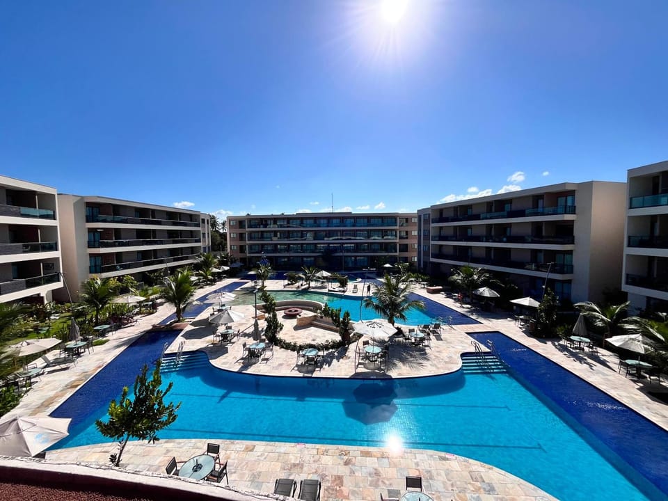 Property building, Day, Pool view, Swimming pool, sunbed