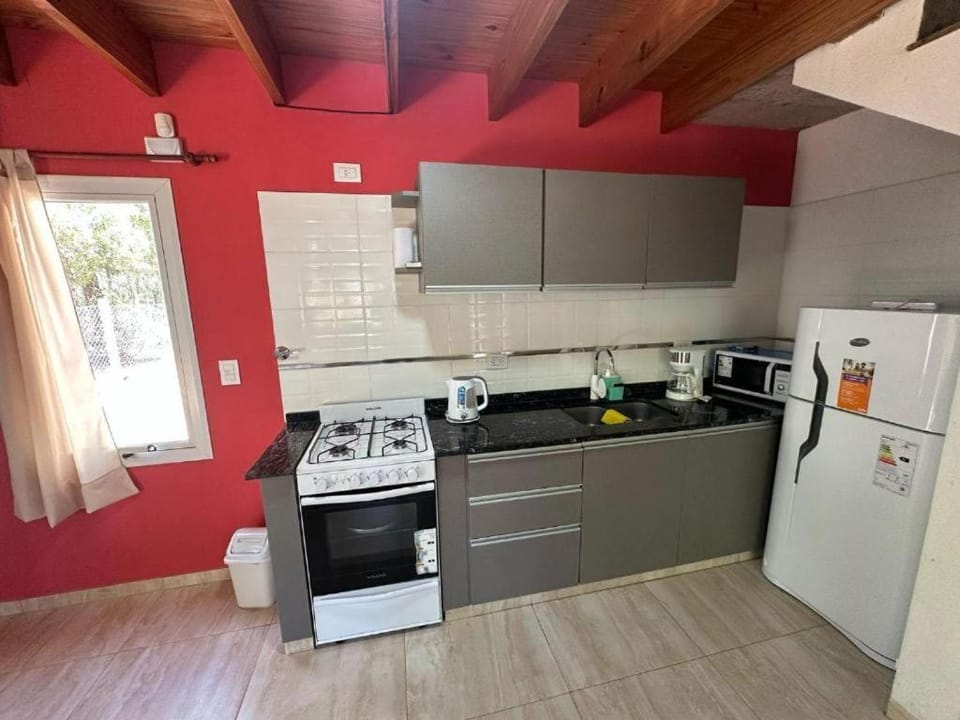 Kitchen or kitchenette, microwave, oven, toaster