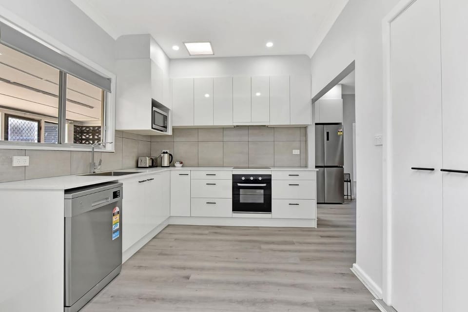 Kitchen or kitchenette, dishwasher, oven, stove, toaster