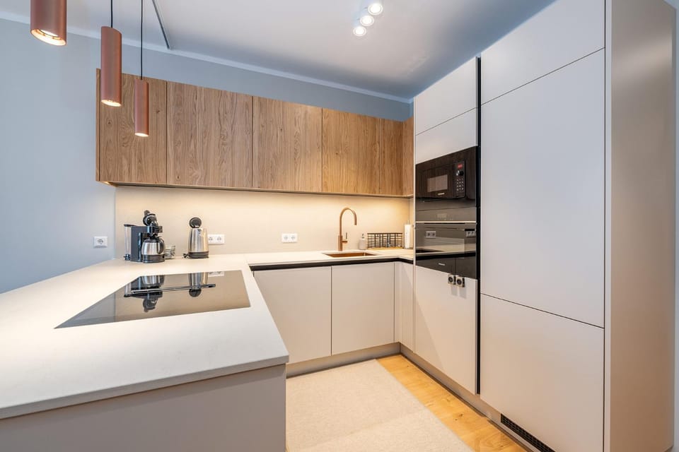 Kitchen or kitchenette, dishwasher, oven, stove