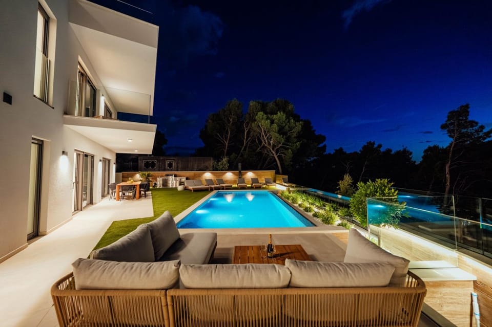 Property building, Night, Seating area, Swimming pool, sunbed