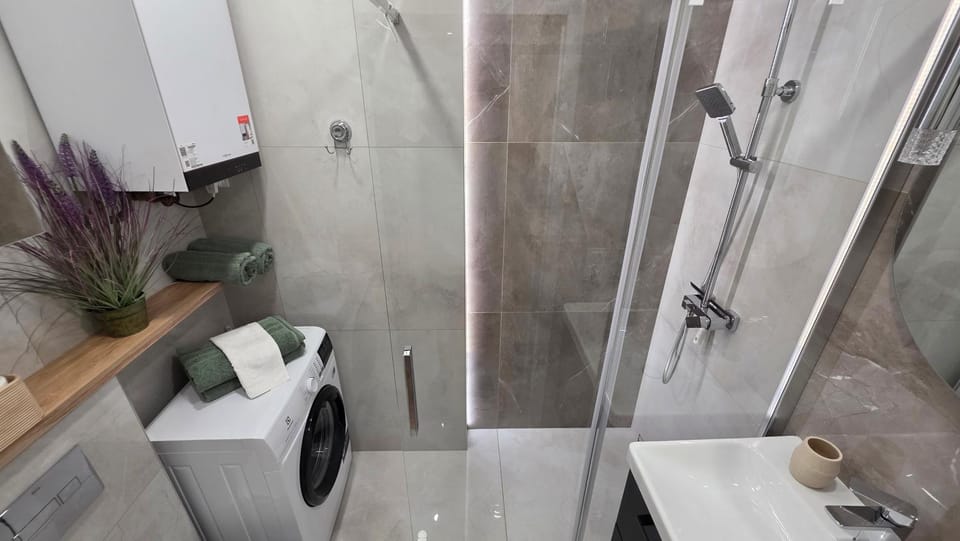 Shower, Toilet, Bathroom, towels, washing machine, dryer