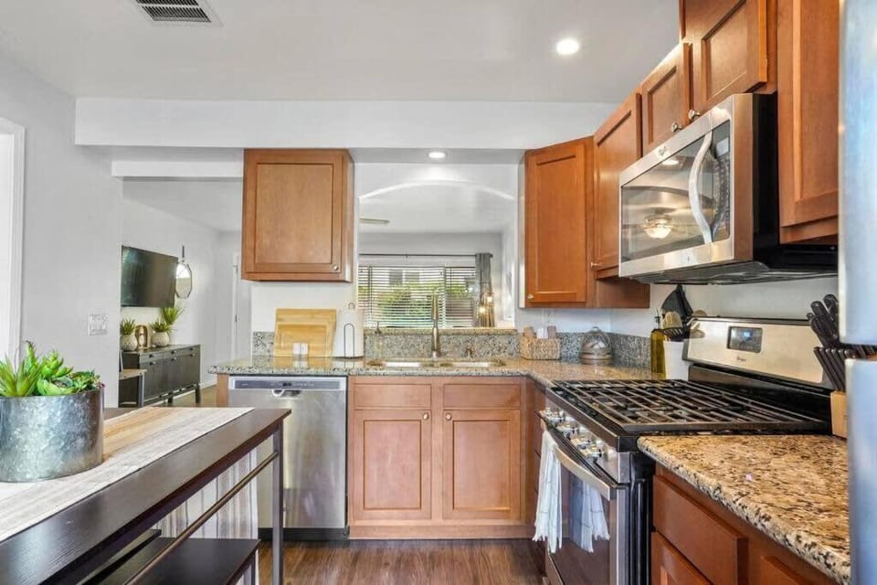 Kitchen or kitchenette, dishwasher, oven, stove