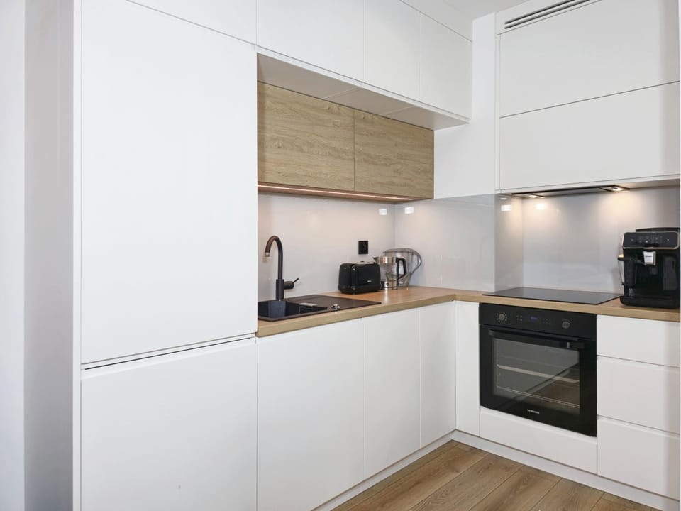 Kitchen or kitchenette, dishwasher, oven, stove, toaster