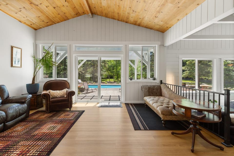 Living room, Seating area, Garden view, Pool view