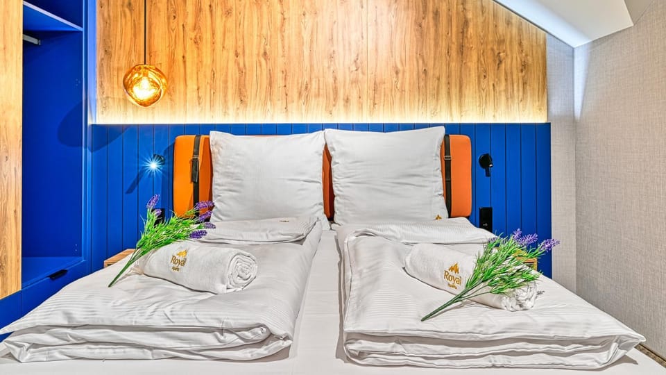 Bed, towels, wardrobe