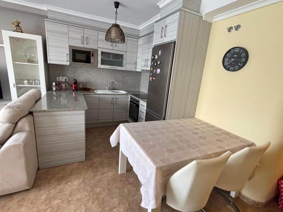 Kitchen or kitchenette, dishwasher, oven, stove