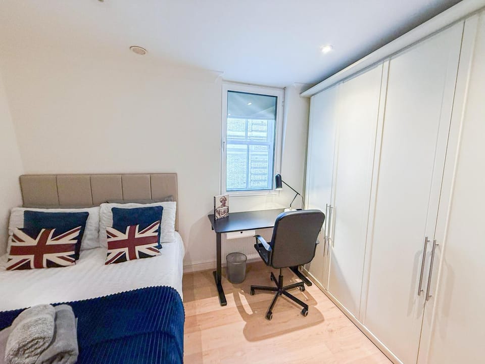 Bed, Seating area, Dining area, Bedroom, flat iron, hair dryier, storage, towels, wardrobe, air conditioner