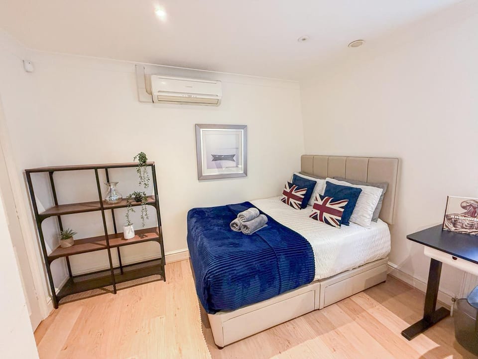 Bed, Decorative detail, Seating area, Bedroom, flat iron, hair dryier, heating, towels, wardrobe, air conditioner