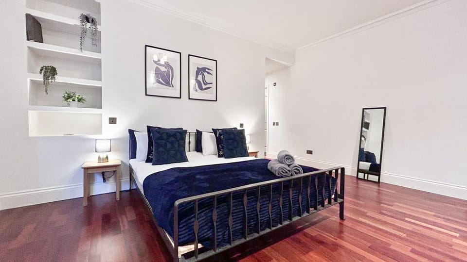 Bed, Bathroom, Photo of the whole room, Decorative detail, Seating area, Bedroom, flat iron, hair dryier, heating, towels, wardrobe
