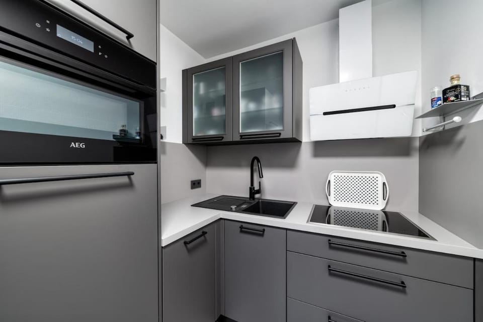Kitchen or kitchenette, dishwasher, oven, stove