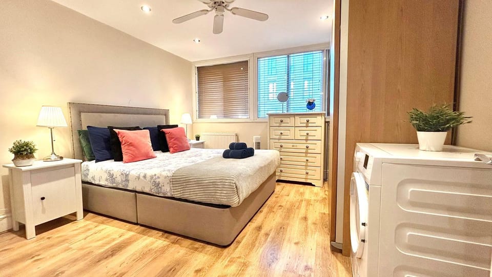 Bed, Photo of the whole room, Decorative detail, Bedroom, flat iron, hair dryier, heating, storage, towels, wardrobe, washing machine, dryer