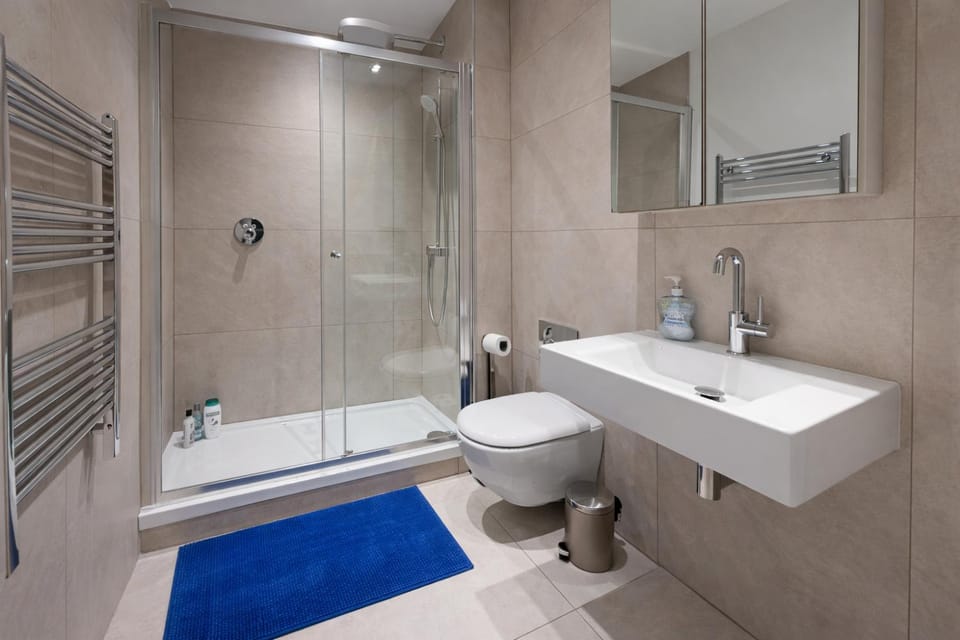 Shower, Toilet, Bathroom, hair dryier, towels