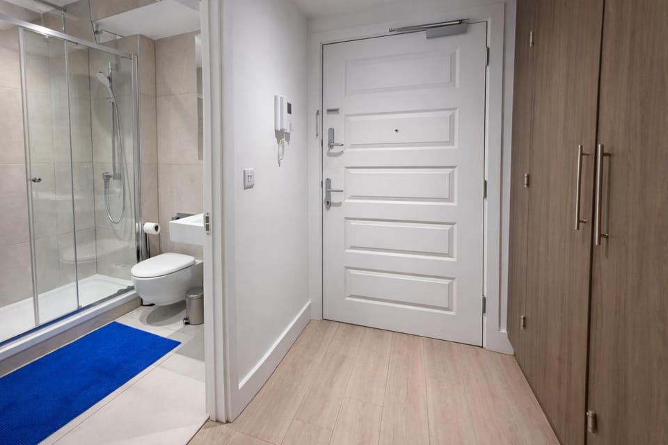 Shower, Toilet, Bathroom, hair dryier, heating, wardrobe, washing machine, dryer