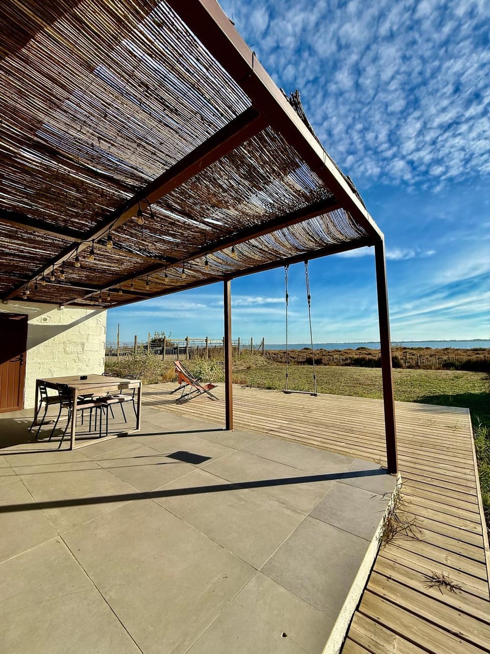 Property building, Patio, Day, Garden, View (from property/room), Balcony/Terrace, Dining area, Lake view