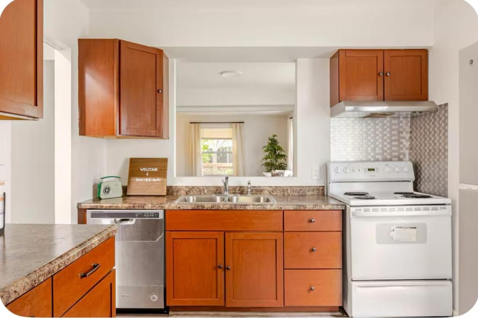 Kitchen or kitchenette, dishwasher, oven, stove