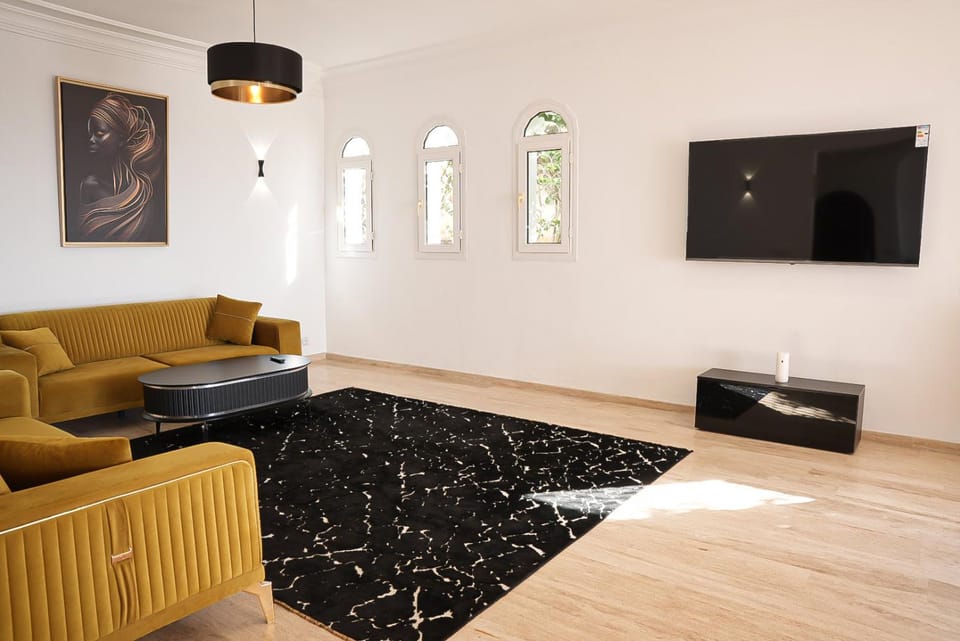 Property building, TV and multimedia, Living room, Seating area, Swimming pool