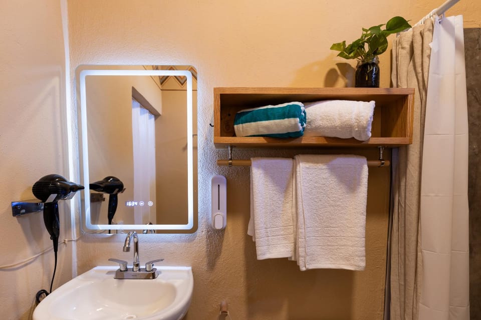 Shower, Toilet, Bathroom, hair dryier, towels