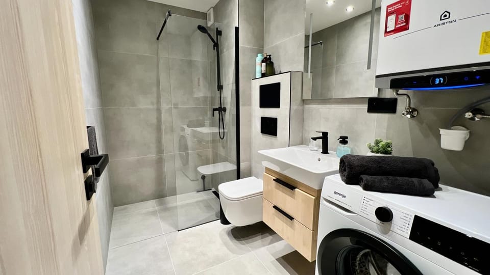 Shower, Toilet, Bathroom, towels, washing machine, dryer