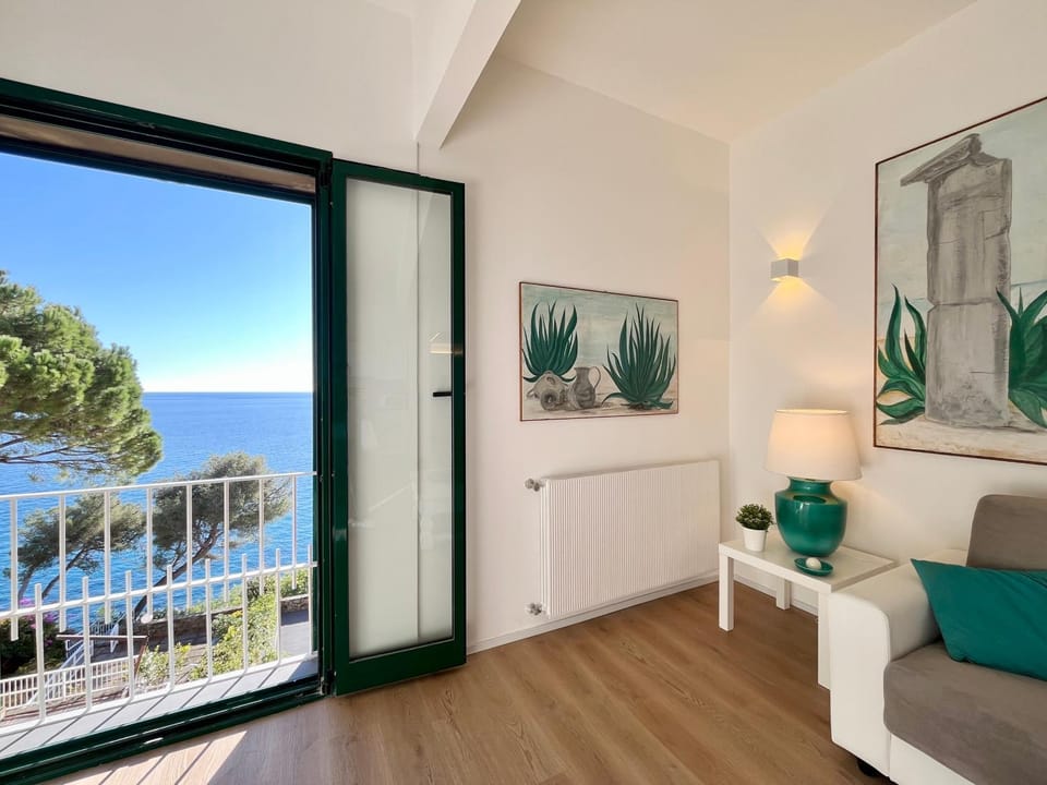 Natural landscape, View (from property/room), Living room, Seating area, Sea view