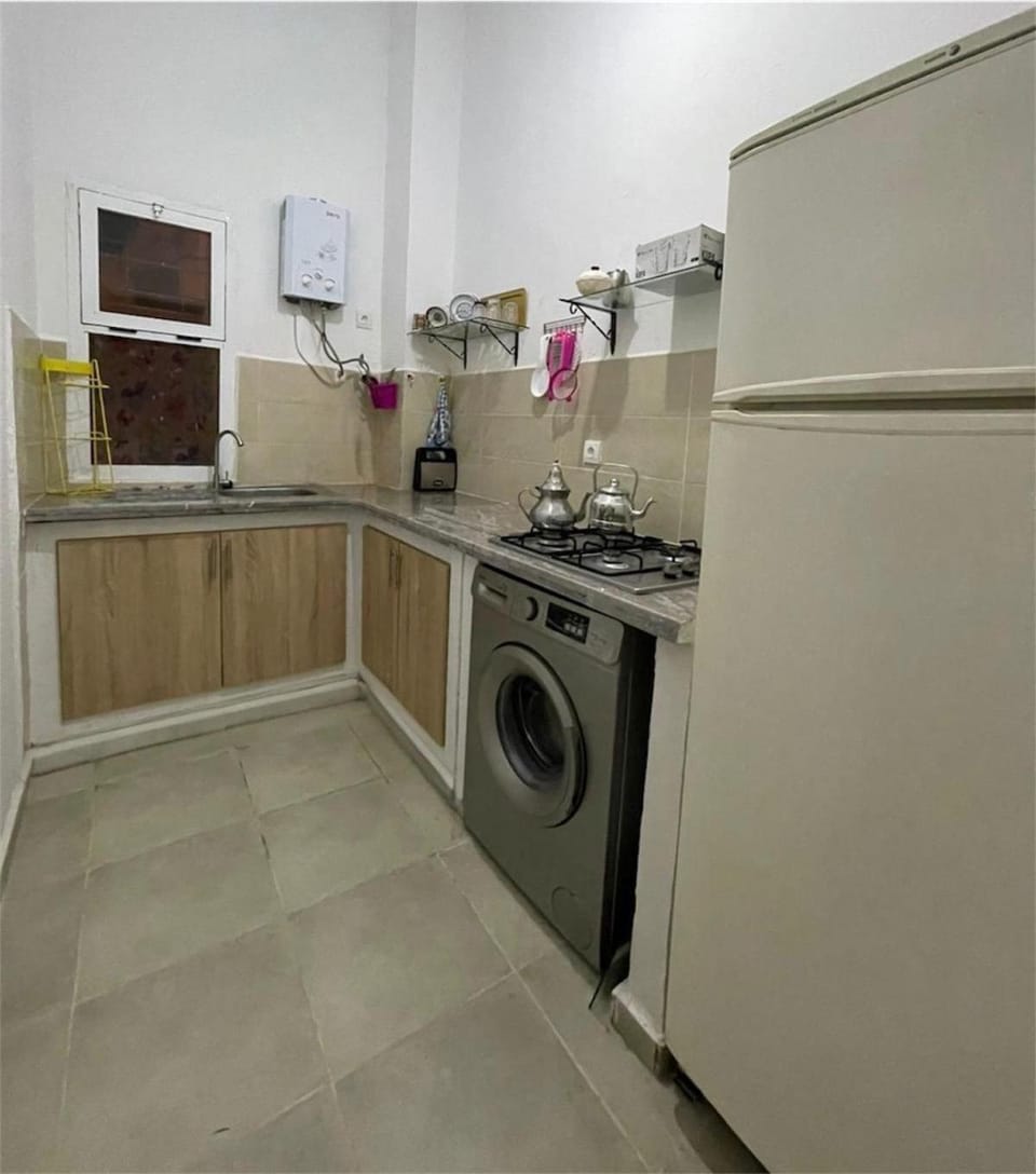 Kitchen or kitchenette, washing machine