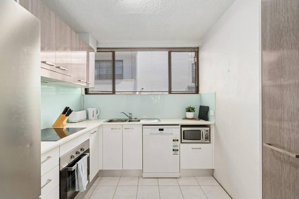 Kitchen or kitchenette, dishwasher, oven, stove, toaster