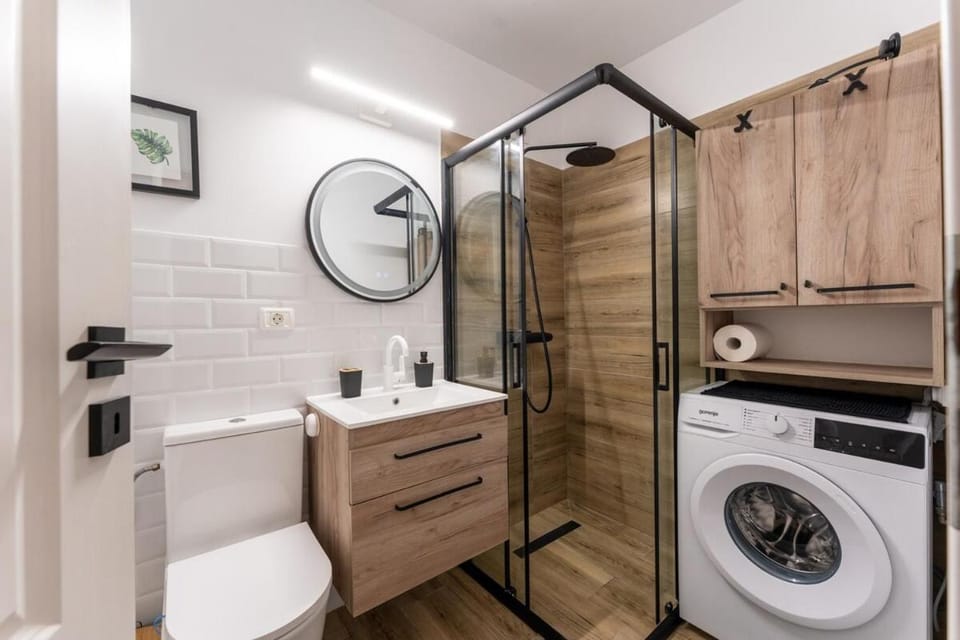 Shower, Toilet, Bathroom, towels, washing machine, dryer