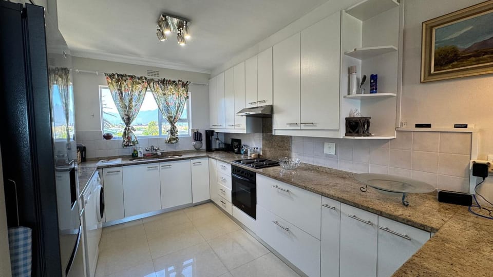 Kitchen or kitchenette, dishwasher, oven, stove, toaster, kitchen