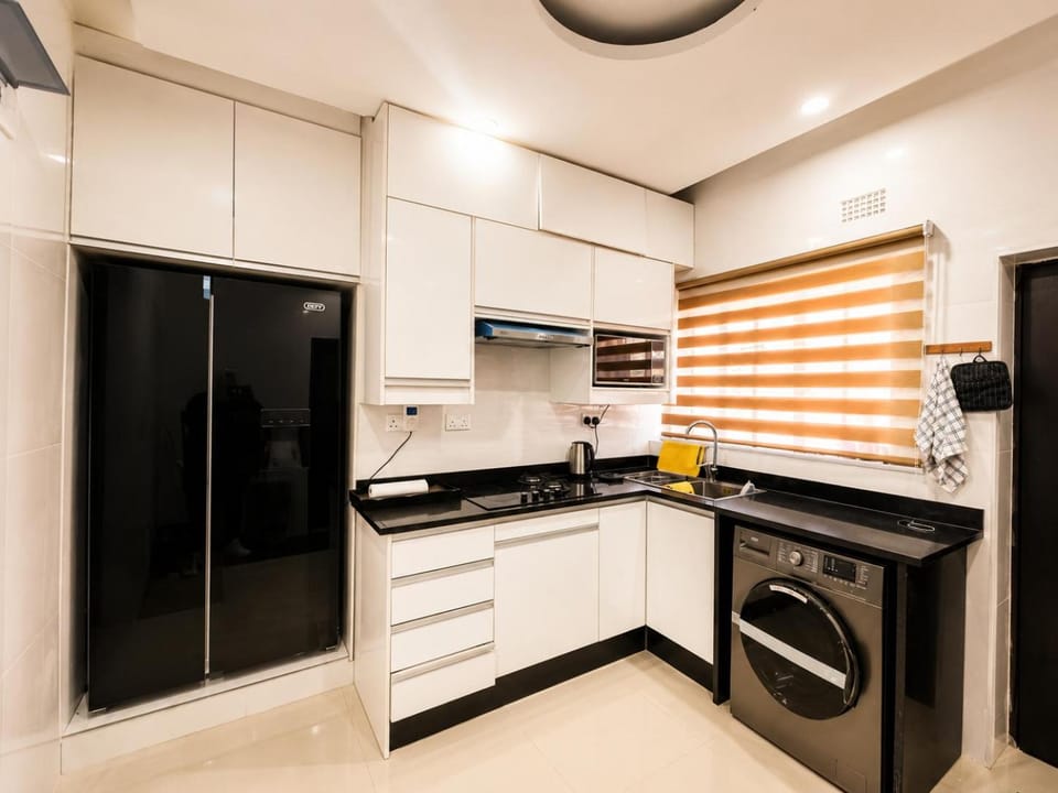 Kitchen or kitchenette, stove, toaster, washing machine