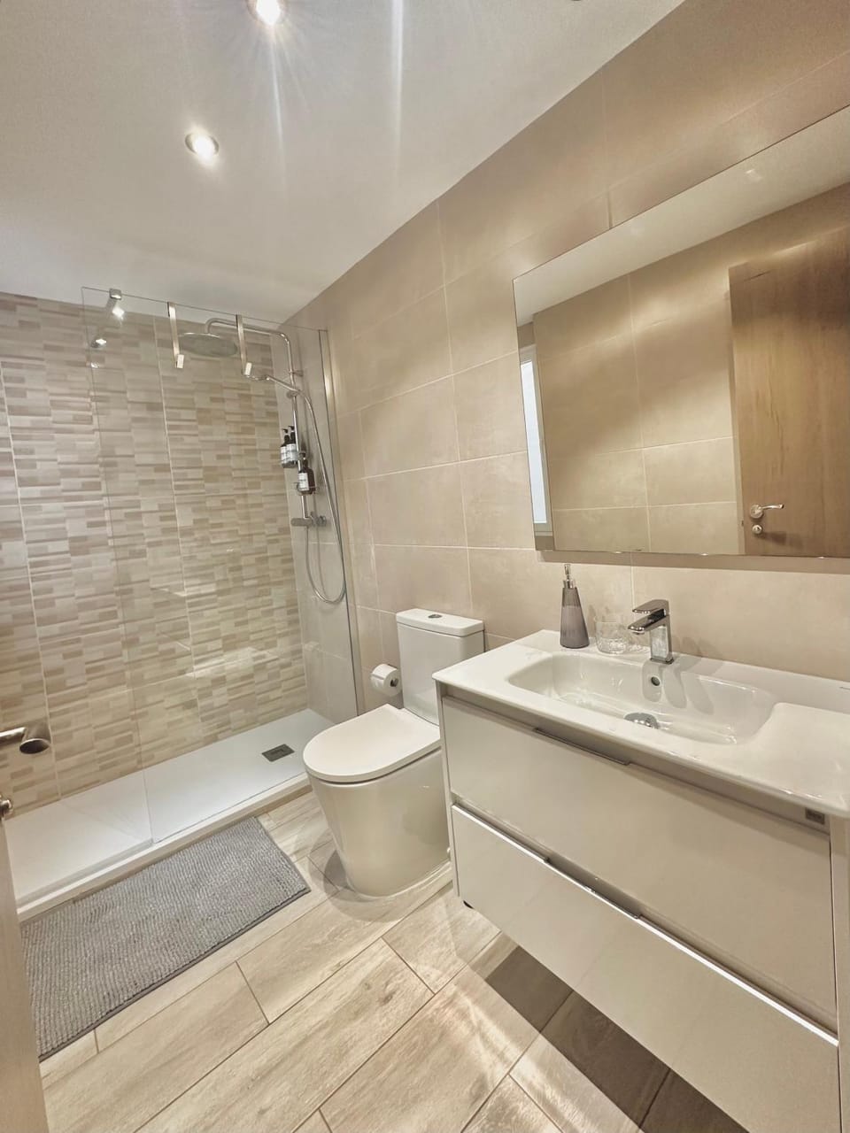 Shower, Toilet, Bathroom, hair dryier, towels