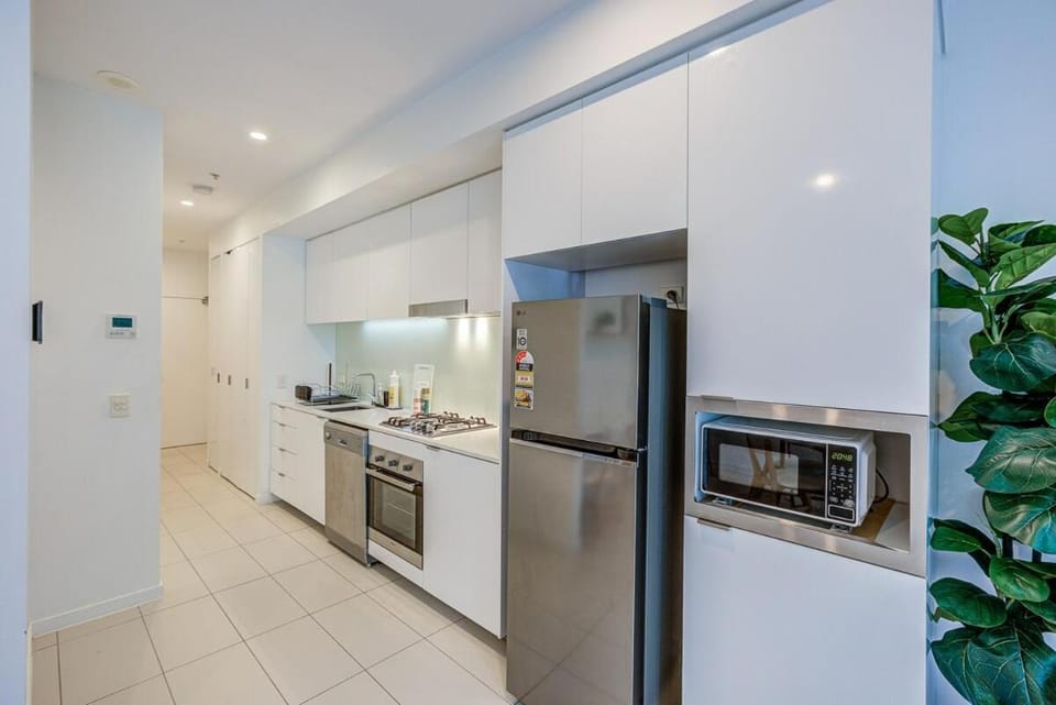 Kitchen or kitchenette, dishwasher, oven, stove, toaster