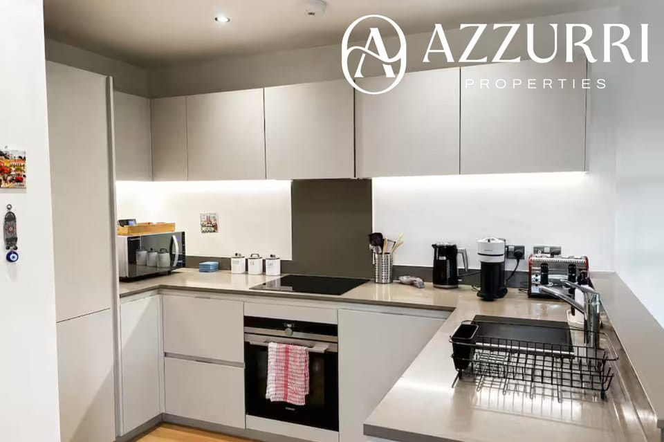 Kitchen or kitchenette, dishwasher, oven, stove, toaster