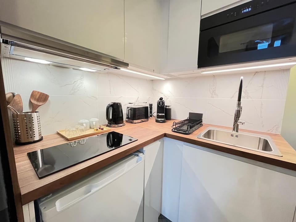 Kitchen or kitchenette, stove, toaster