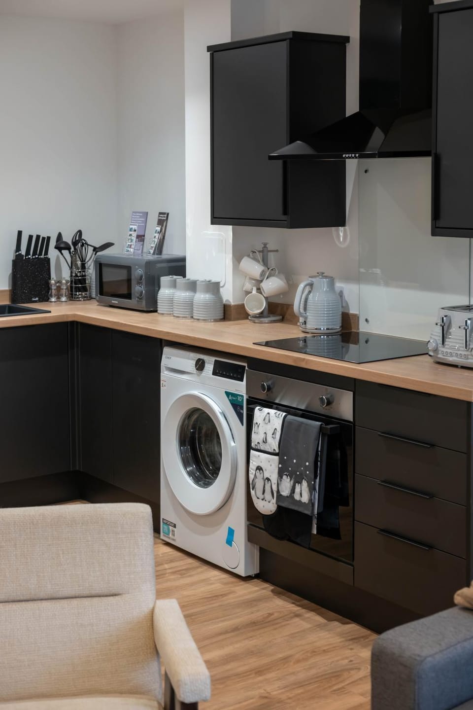Kitchen or kitchenette, stove, toaster, washing machine