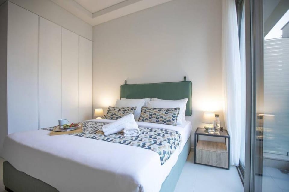 Bed, Bedroom, hair dryier, towels, wardrobe