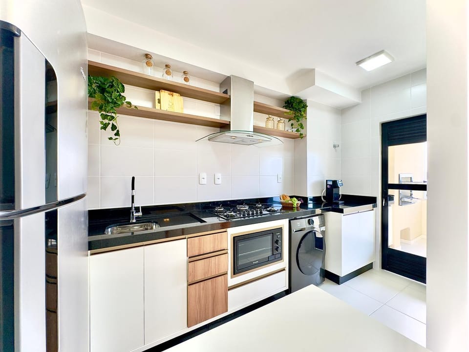 Kitchen or kitchenette, oven, stove, washing machine