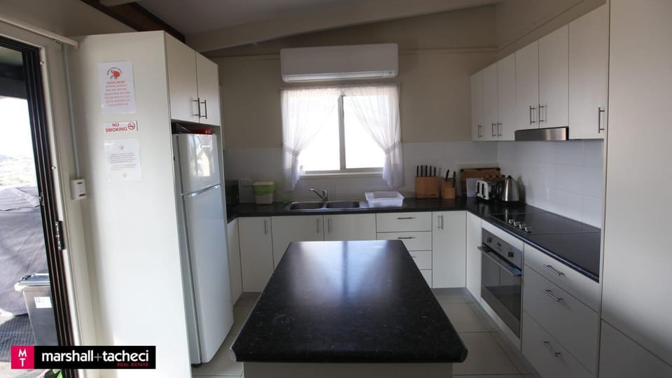 Kitchen or kitchenette, oven, stove, toaster