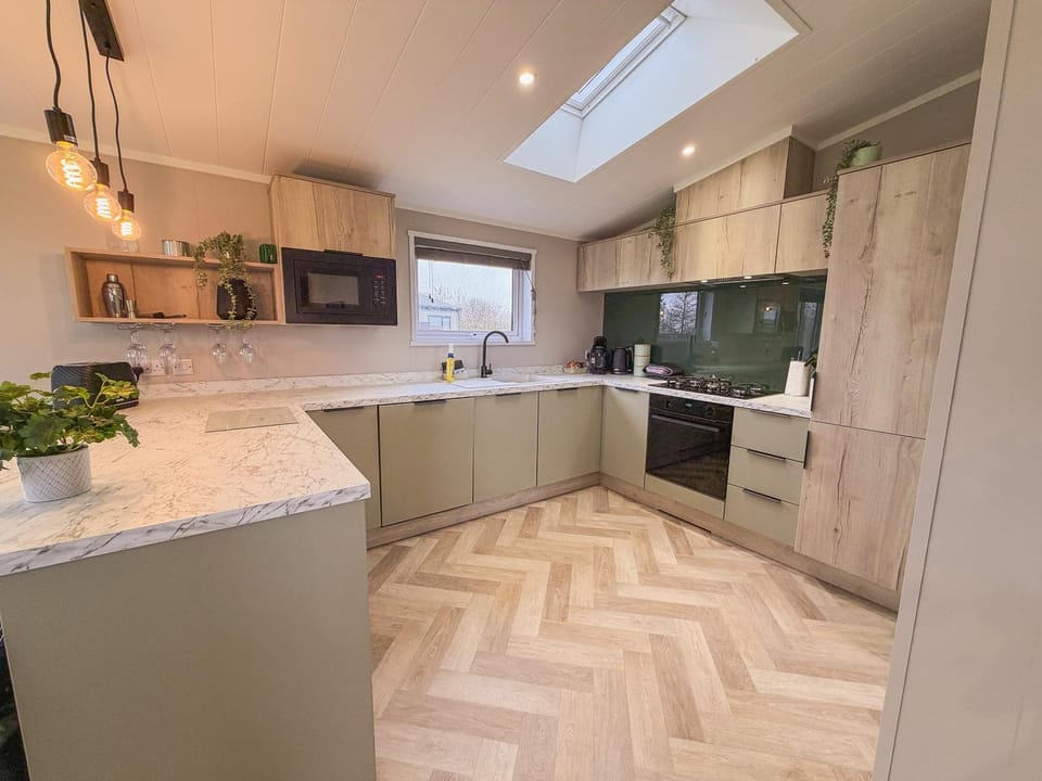 Kitchen or kitchenette, dishwasher, oven, stove