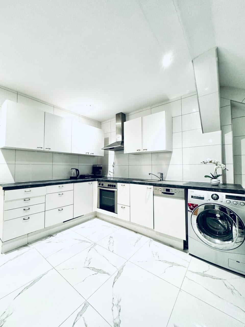 Kitchen or kitchenette, dishwasher, stove, washing machine