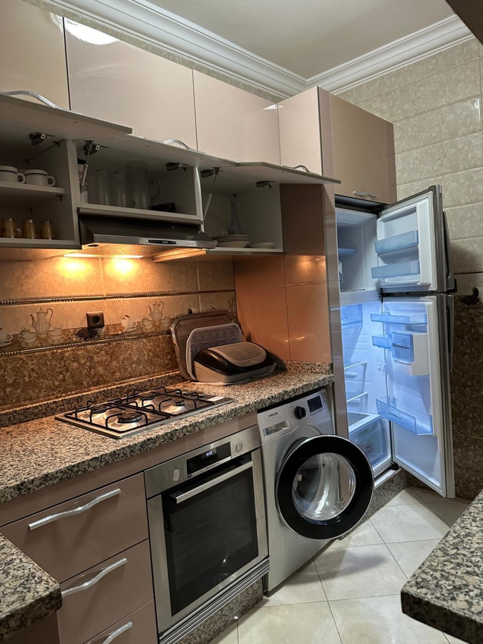 Kitchen or kitchenette, oven, stove, washing machine