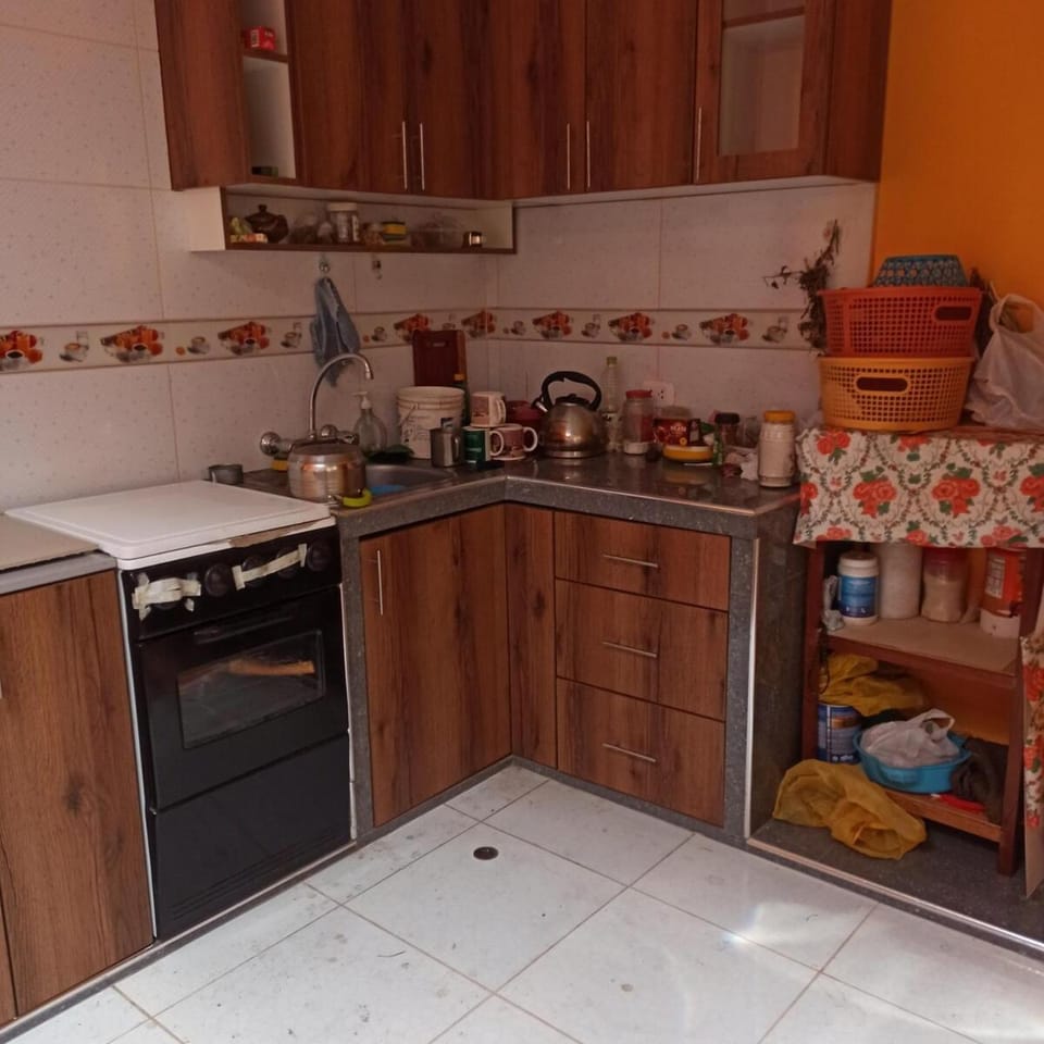A mini apartment with a kitchen- casa de Eva Apartment in Puno