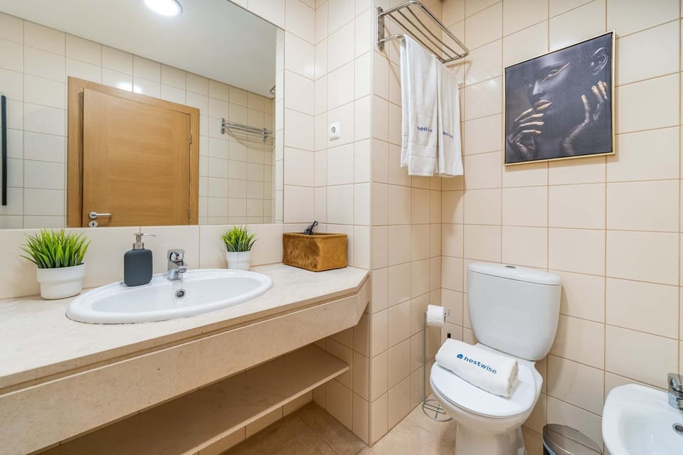 Bathroom, bidet, towels