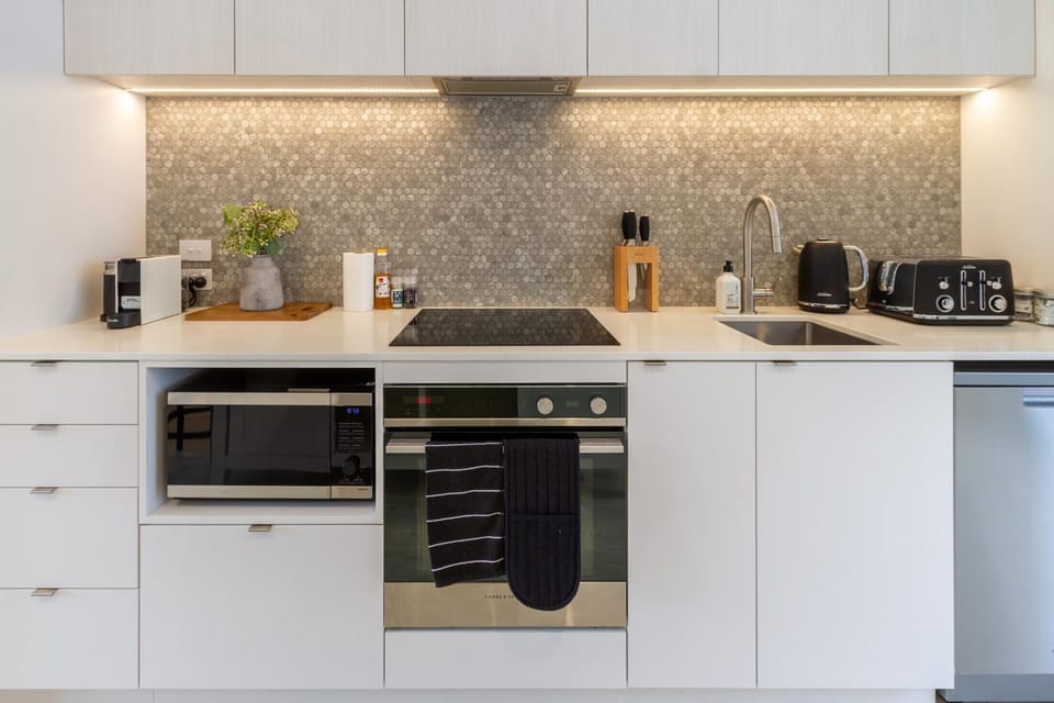 Kitchen or kitchenette, dishwasher, stove, toaster
