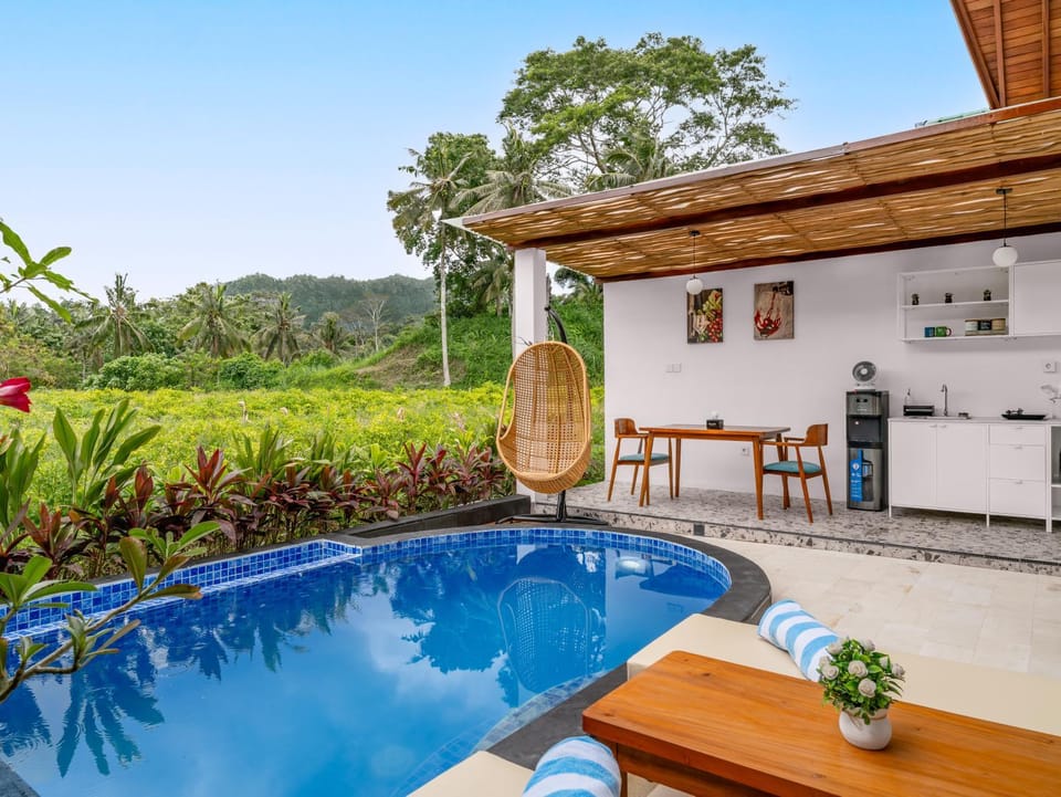 Property building, Patio, Day, Natural landscape, Garden, Dining area, Garden view, Pool view, Swimming pool