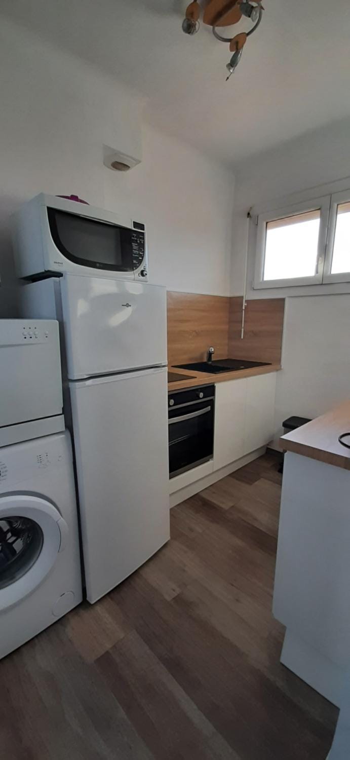 Kitchen or kitchenette, dishwasher, oven, stove, washing machine