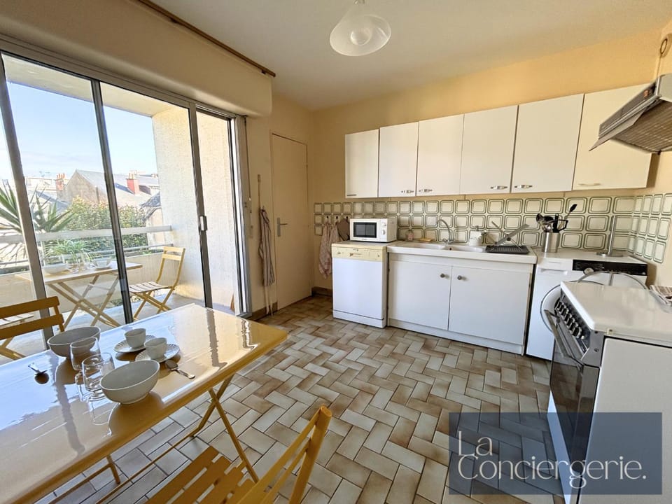 Dining area, dishwasher, oven, toaster, kitchen